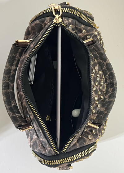 Leopard print handbag with gold accents on a white background